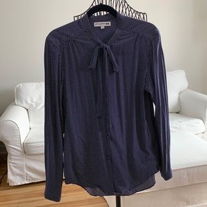 Long-sleeve navy polka dots blouse with bow